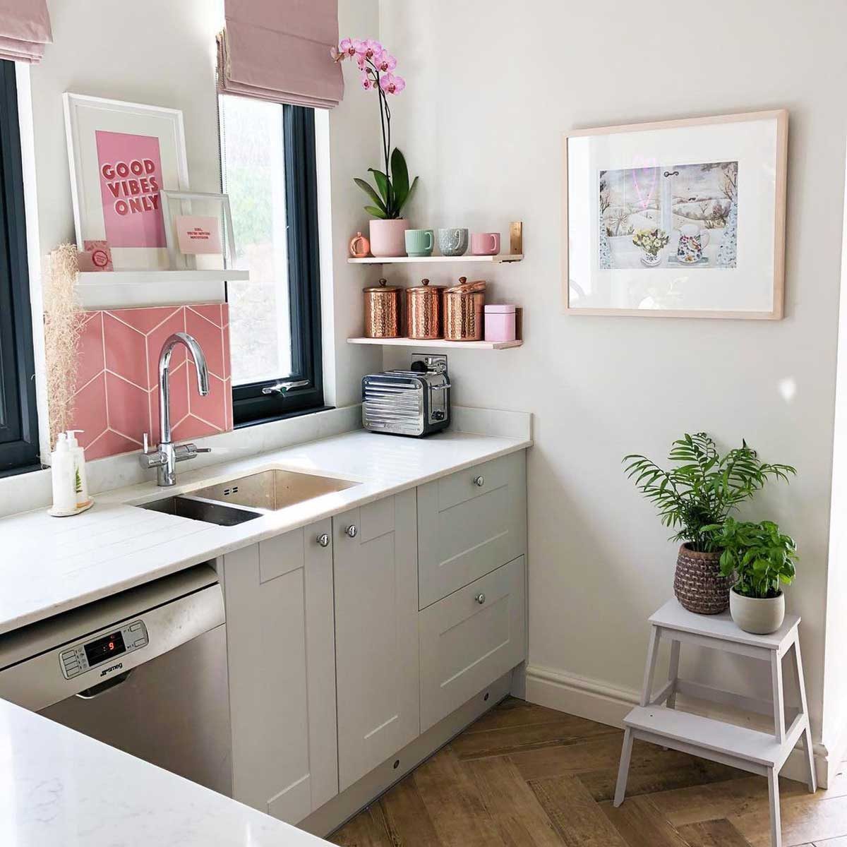 Kitchen with pink artwork