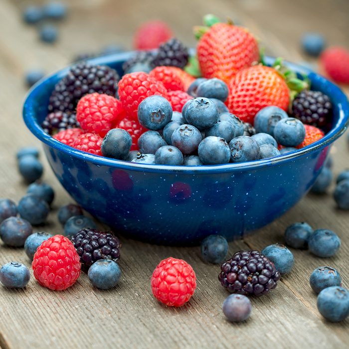 paleo snacks A bowlful of delicious organic berries. Strawberries, blackberries, blueberries and raspberries. 