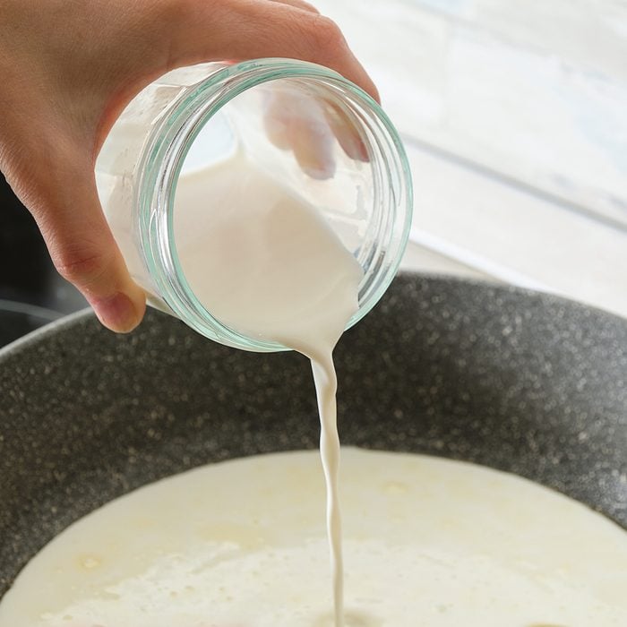 Pouring cream into pan