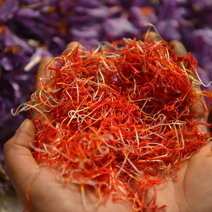 indian spices A Kashmiri farmer shows saffron petals after being picked from flowers at a farm in Pampore, south of Srinagar on November 1, 2016. - Kashmir is one of the few places in the world, where the world's most expensive spice grows. It is used as a flavouring and colouring agent in many recipes. (Photo by TAUSEEF MUSTAFA / AFP) (Photo credit should read TAUSEEF MUSTAFA/AFP via Getty Images)