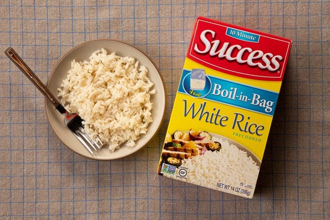 Overhead Shot Of Success White Rice In Package And On Plate