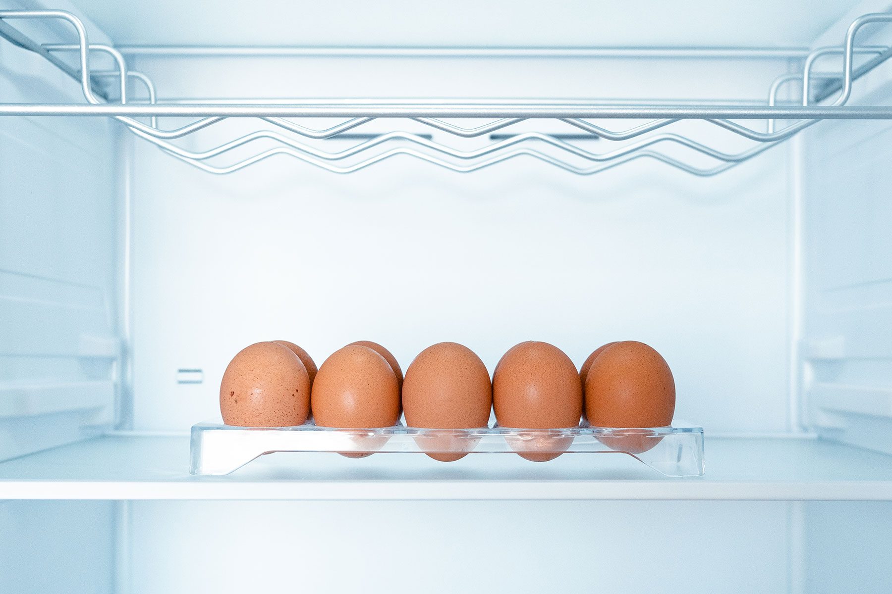 carton of eggs in middle shelf of the fridge