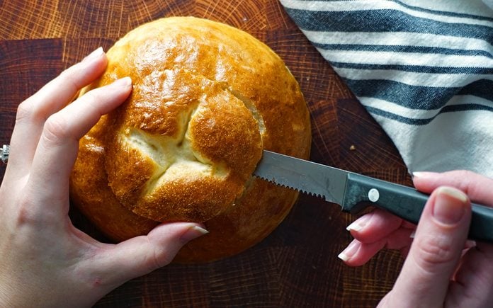 cut a small, angled circle from the top of each bread bowl copycat panera bread bowl