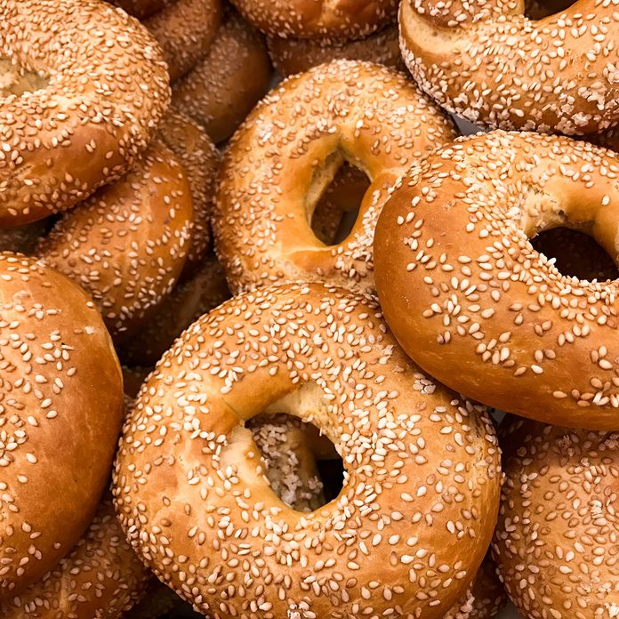 Close Up Of A Pile Of Freshly Baked Bagels Sprinkled With Sesame Seeds