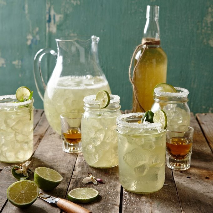 Margaritas in mason jars with shots of tequila