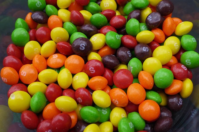 Close Up Of Multi Colored Skittles Candy in a jar