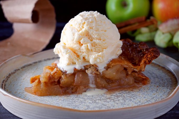 Apple Pie In A Bag slice of apple pie baked in a paper bag on a plate with ice cream