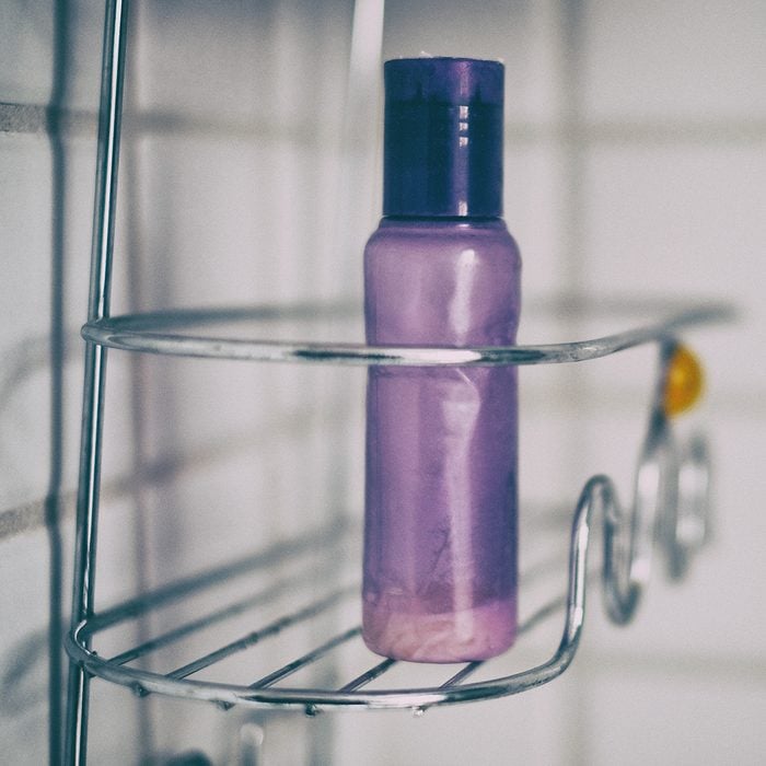 Purple Bottle In Shower Caddy