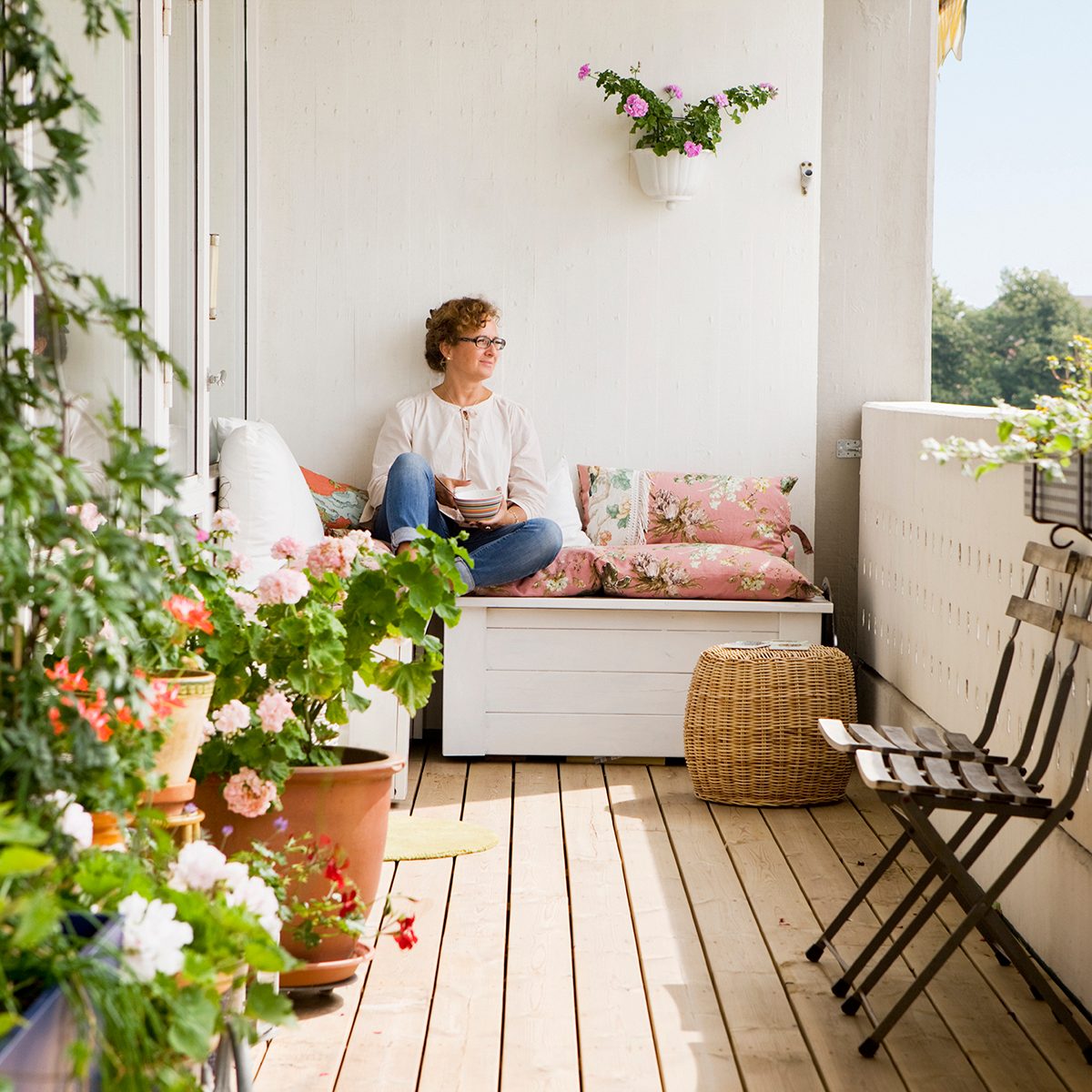 backyard entertainment ideas Woman Relaxing On Balcony