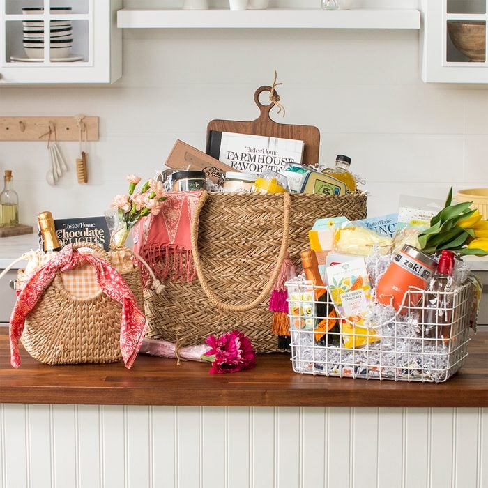 Gift baskets group; three gift baskets arranged on a kitchen counter