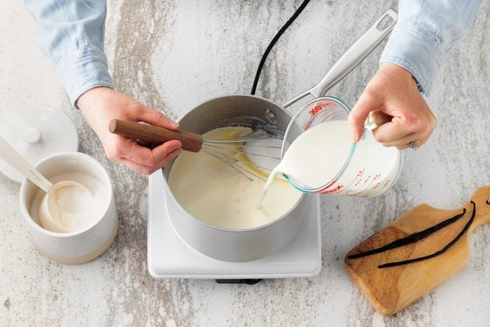 a heavy saucepan over medium heat and stir in the heavy whipping cream, milk, sugar and salt