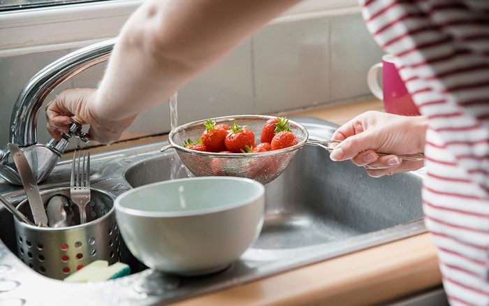 how to wash berries Rinsing Off The Strawberries