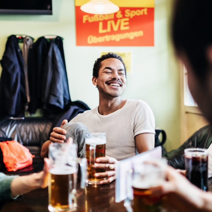 Group Of Friends Drinking Together At A Pool Hall