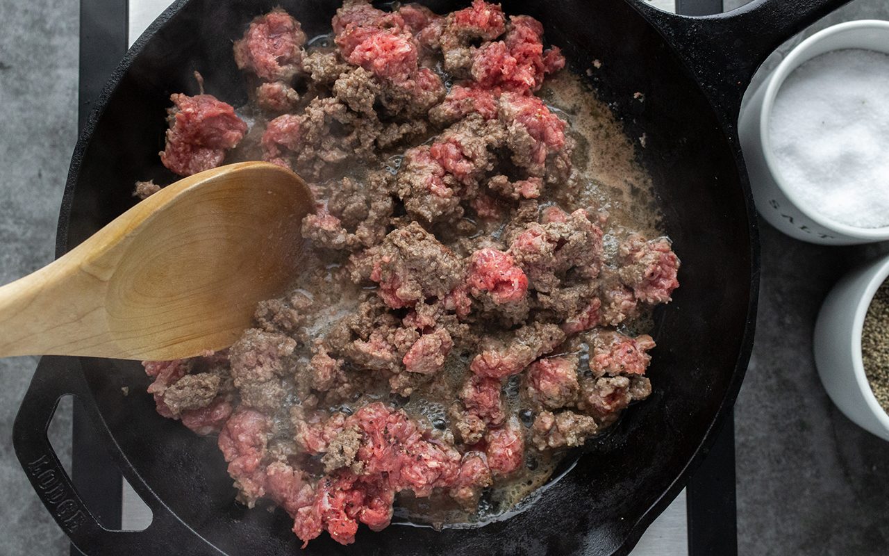 A heat-resistant utensil to break up ground beef, stir sauces