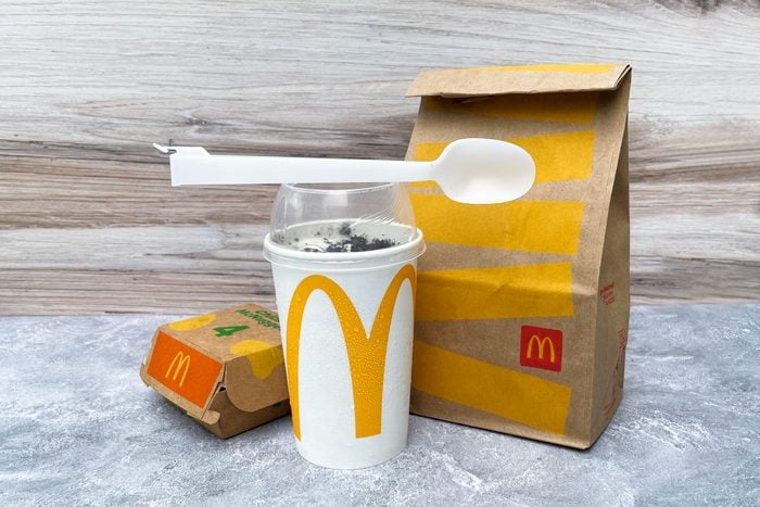 Mcdonalds Mcflurry and spoon with mcdonalds bag and chicken nuggets container