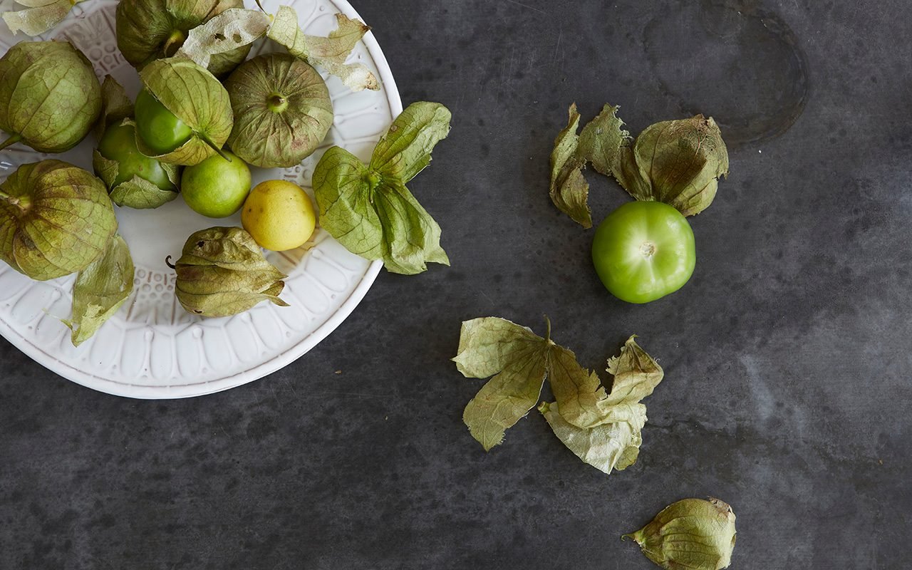 Fresh Tomatillos On A Plate And Zinc Metal Surface