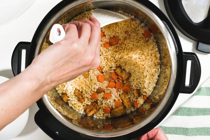 Rice With Meat And Vegetables Prepared In Multi Cooker, Close Up On White Background, View From Above