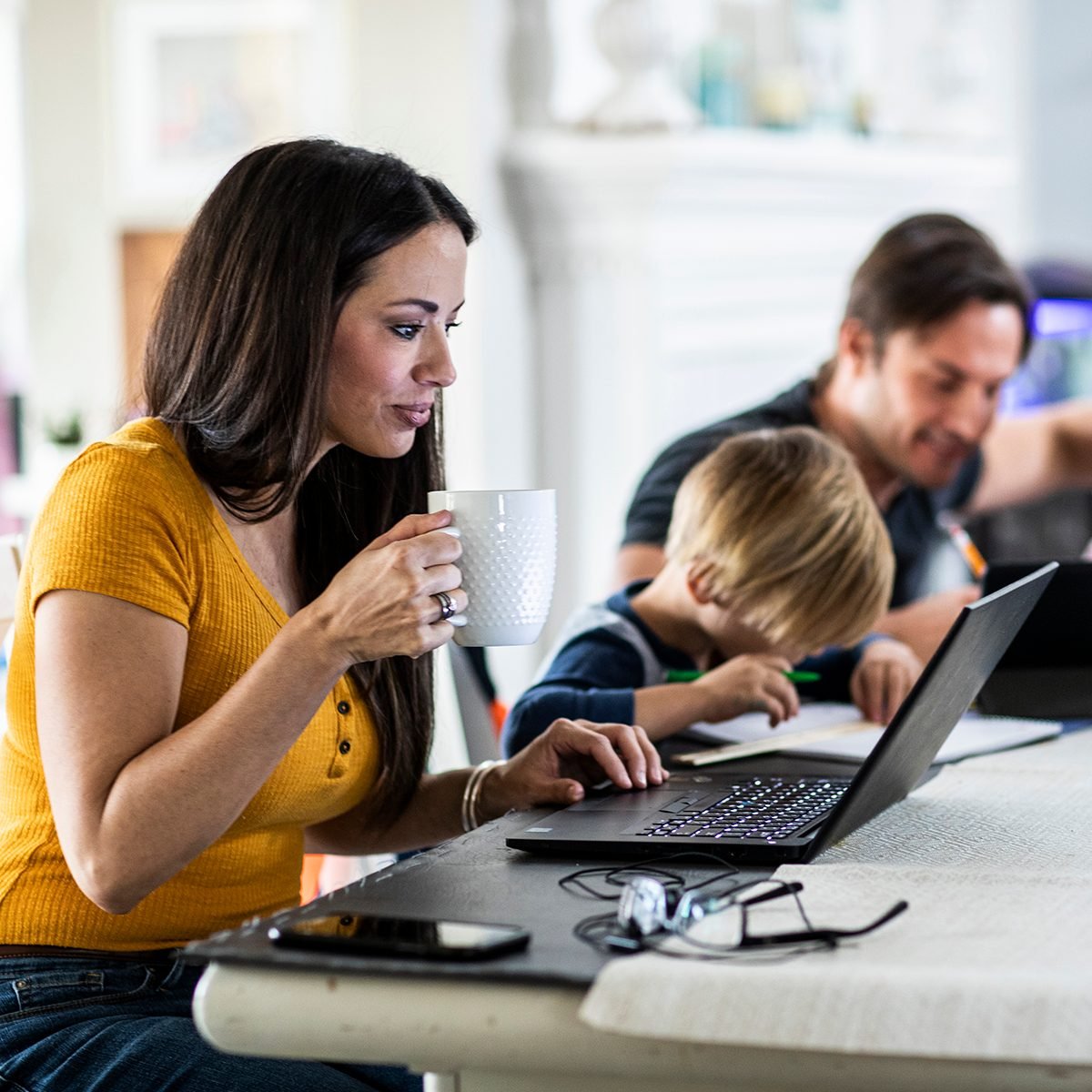 Mother Working From Home While Children Attend School Online