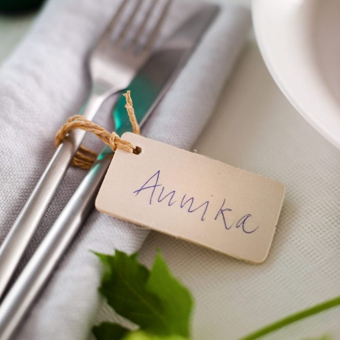 Cutlery on napkin with place card