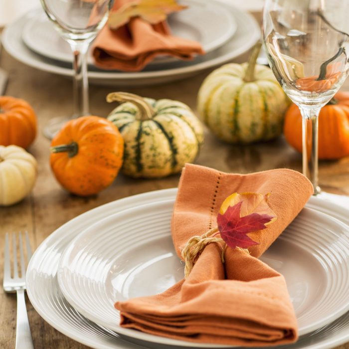 Table setting with small pumpkins