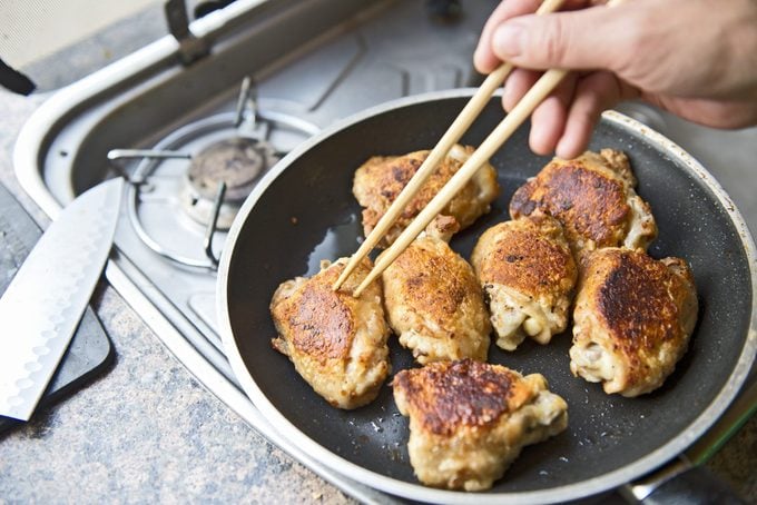 Chicken thighs in a frying pan