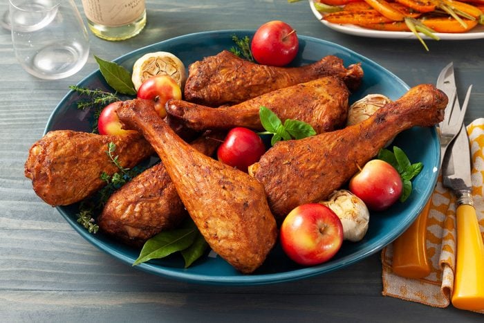 Grilled Turkey Drumsticks on Plate with Tomatoes
