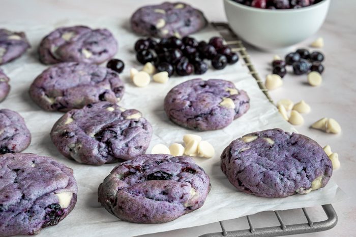 Viral Blueberry Cookies on a cooling rack on a marble countertop