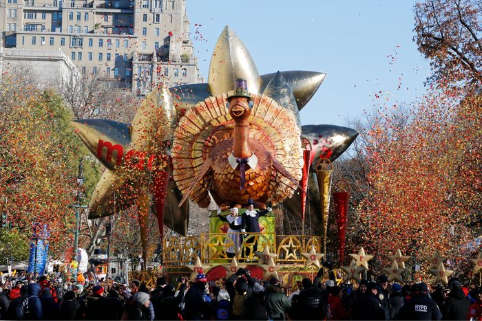 A turkey float among a crowd and confetti leads the 92nd Annual Macy's Thanksgiving Day Parade down Central Park West on November 22, 2018 in New York City.