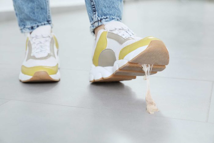 Person Stepping Into Chewing Gum On Floor, Closeup