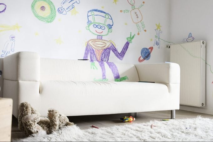 Child's Drawings On Wall In Living Room