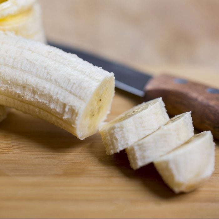 Sliced banana on cutting board