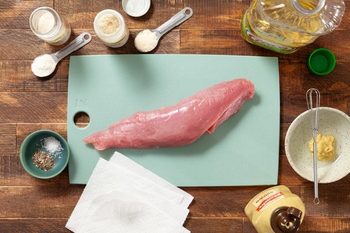 A Raw Meat on a Cutting Board Next to Other Food Items