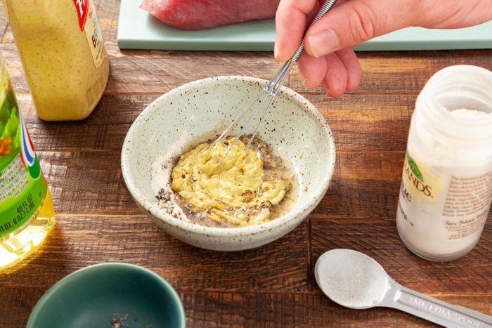 A Person Whisking a Mixture in a Bowl