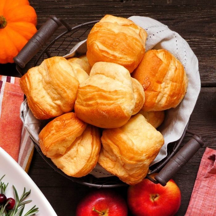 thanksgiving dinner rolls in a basket on the table
