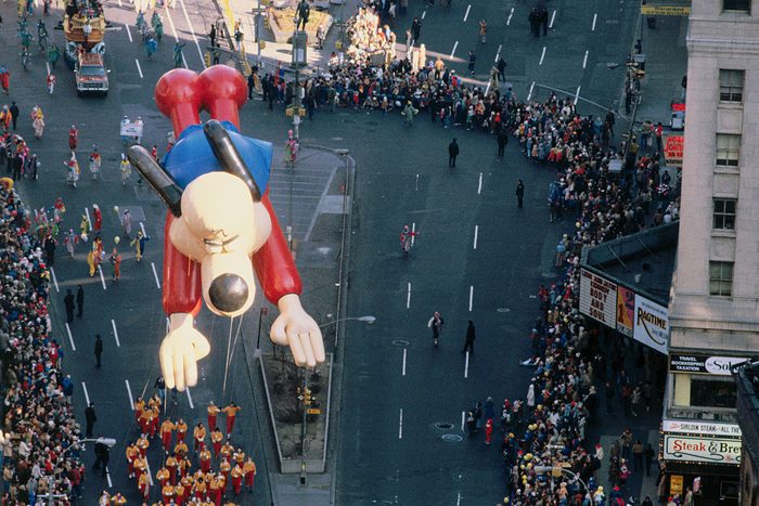 The float of the cartoon character "Underdog" hovers over the crowd gathered to watch the annual Thanksgiving Day Parade in New York City.