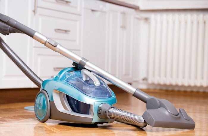 Vacuum cleaner on kitchen floor