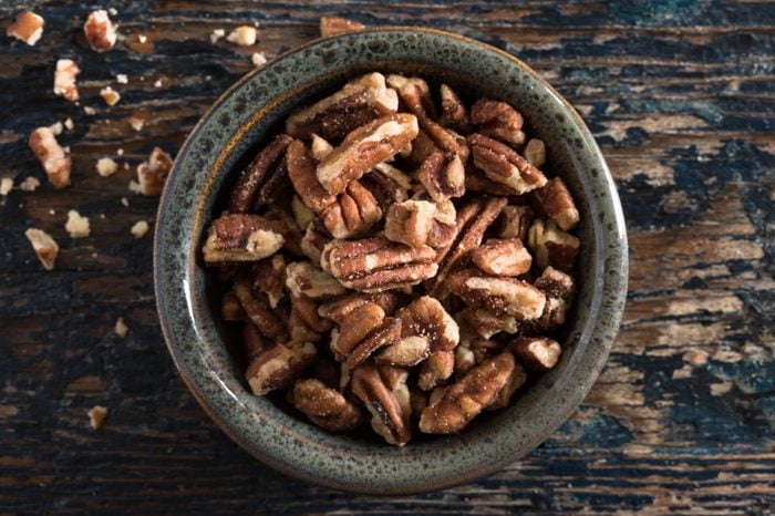 High Angle View Of Pecans In a Bowl On a wooden Table