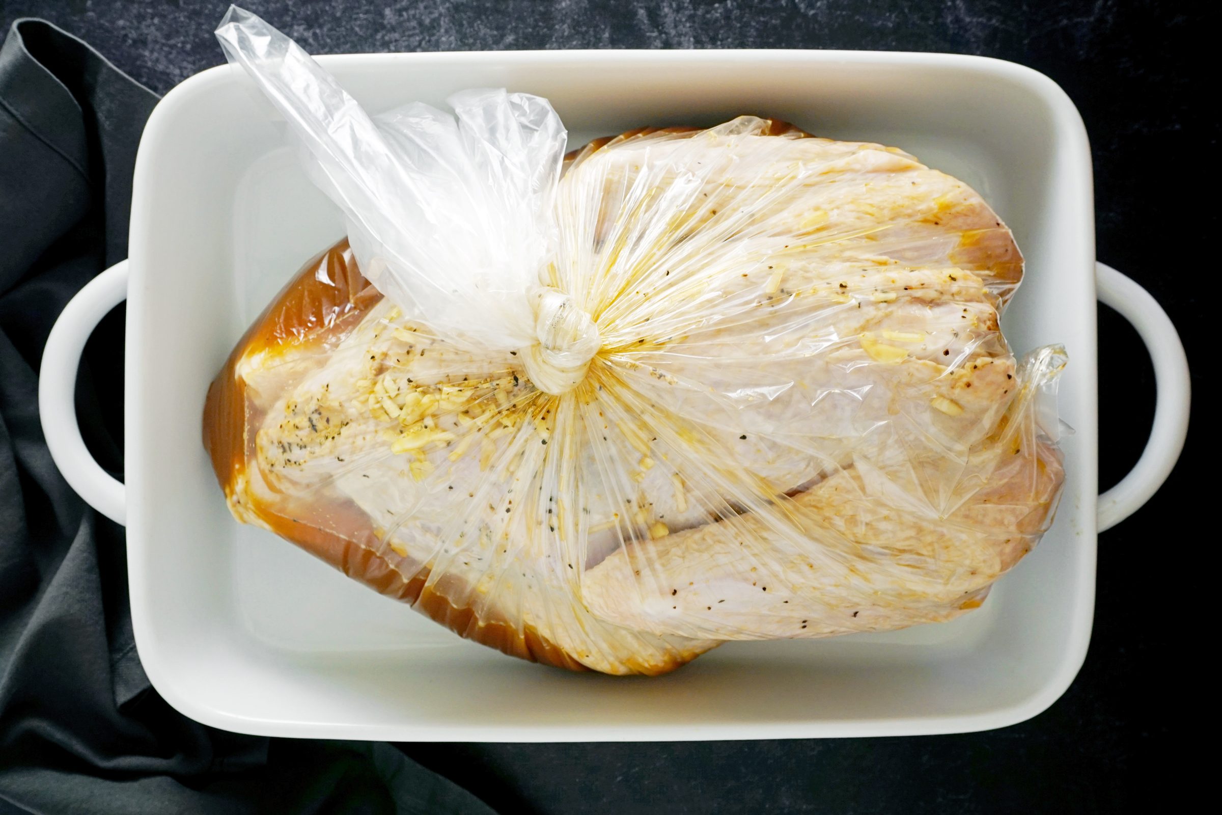 marinating the turkey in a large oven bag