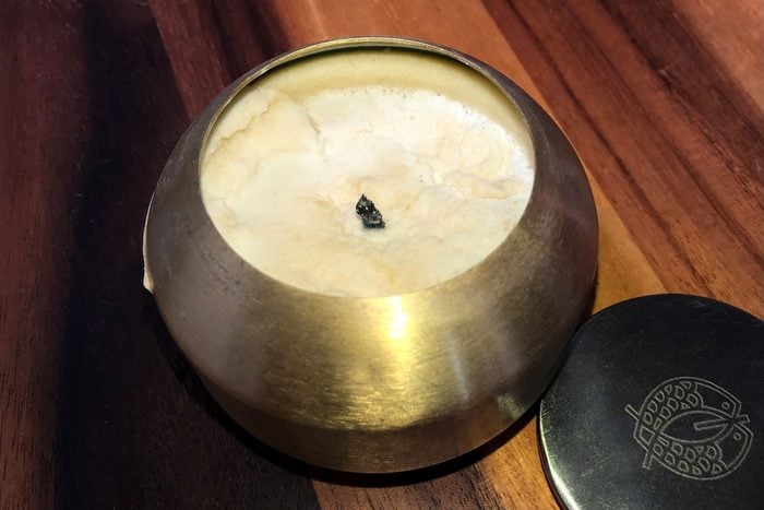 Lumpy Candle on wood background