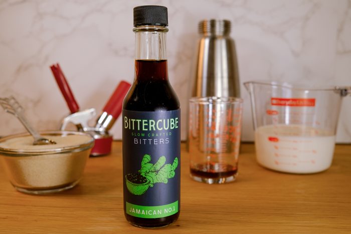 bottle of jamaican bittercube on kitchen counter with baking supplies