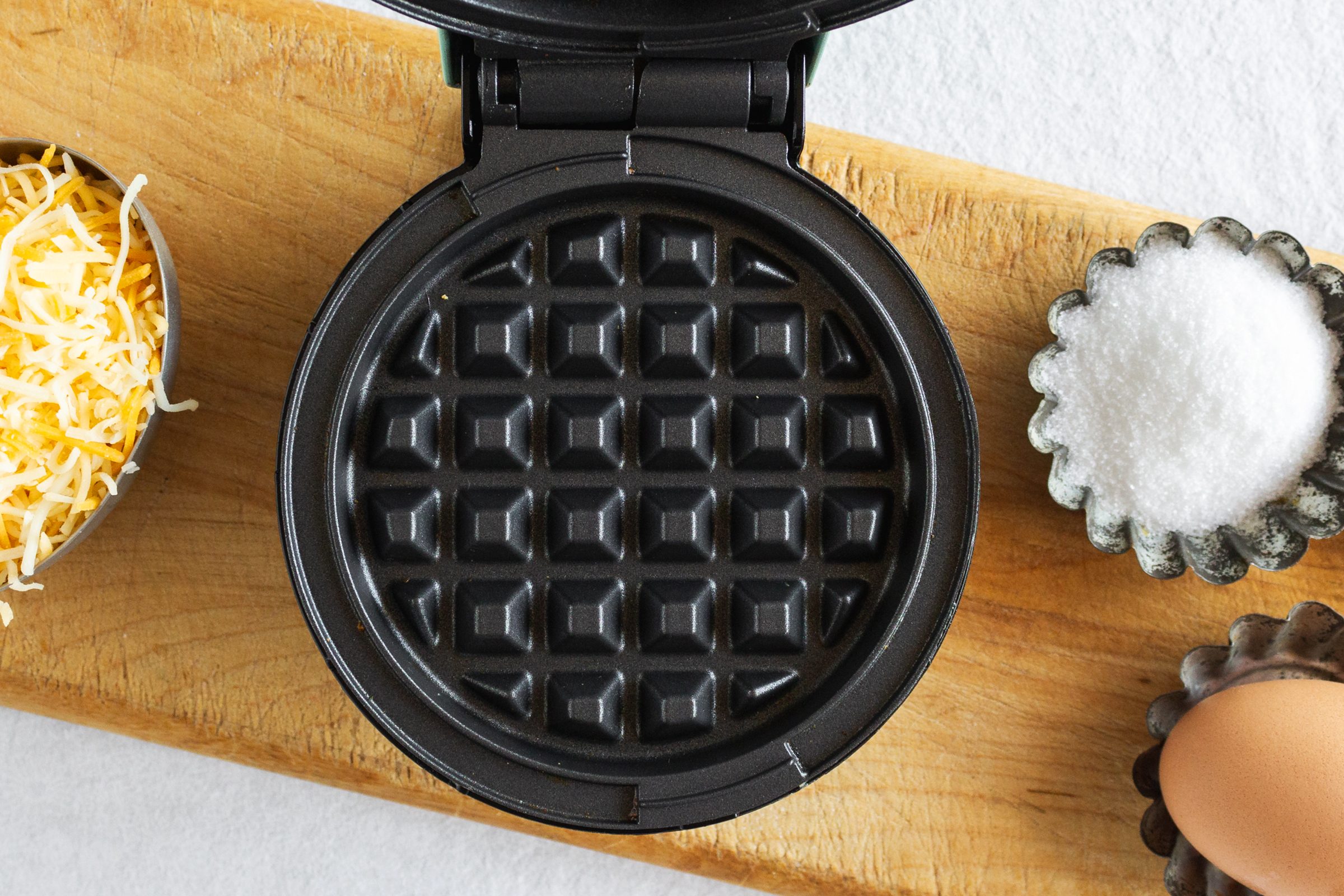 https://www.tasteofhome.com/wp-content/uploads/2021/12/heating-waffle-maker-for-chaffles_nancy-mock.jpg?fit=680%2C454