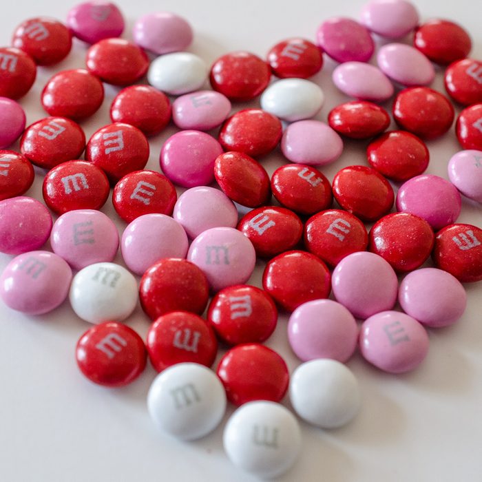 Red Pink And White Valentine M And Ms in shape of a heart
