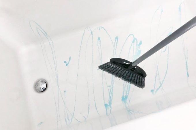 A Genius Shower Cleaning Hack: A Dish Brush