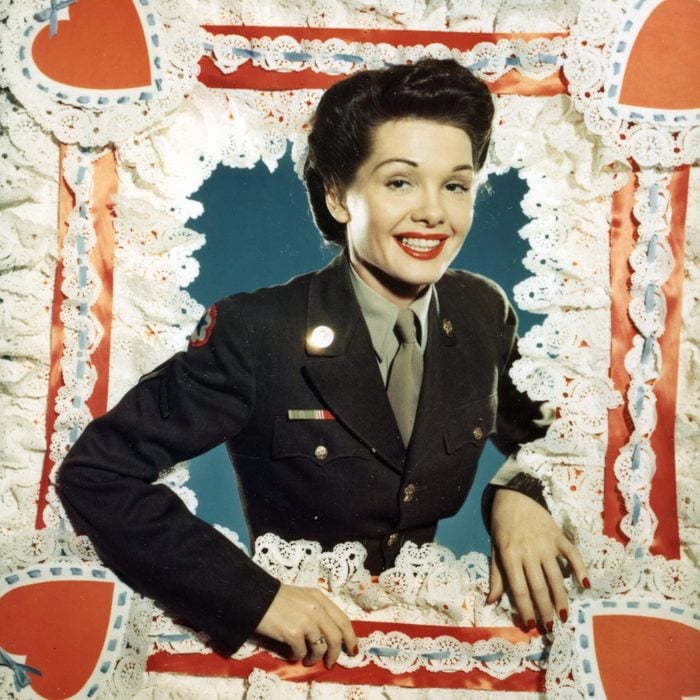 Portrait of Pfc (private first class) Dorothy LeRoy (of Atlanta, Georgia) as she poses in the oversized frame of a Valentine's Day card, Washington DC, 1945. At the time, she worked in the medical records department at Walter Reed General Hospital. (Photo by US Army/Signal Corps/PhotoQuest/Getty Images)