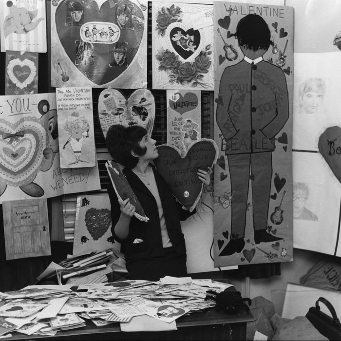 The secretary of the Beatles fan club, surrounded by hundreds of Valentine's cards sent to the group by their adoring fans. 