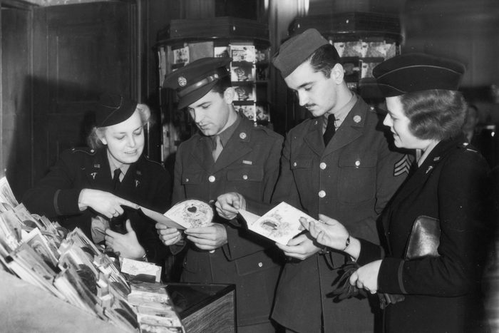 US soldiers in Britain choose Valentine's cards for their sweethearts back home during World War II, 11th February 1943. (Photo by Keystone/Hulton Archive/Getty Images)