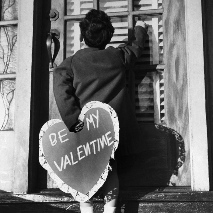 Little Boy Delivering A Valentine.With his heart in his hand, little Johnny McBride, 5, of the "Juvenile Jury," prepares to deliver a valentine surprise to his sweetheart. 