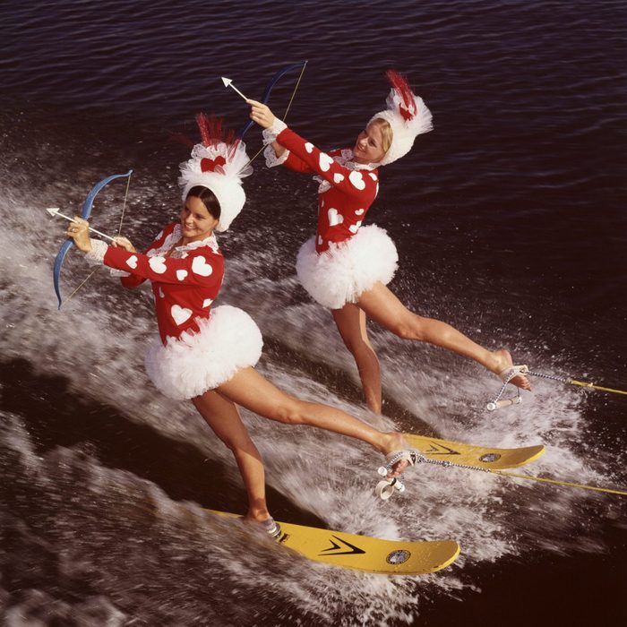 Cypress Gardens, FL: Two pretty cupids take to the water in search of their Valentines. They're performing a difficult backward on their water skis as they aim for their sweethearts.