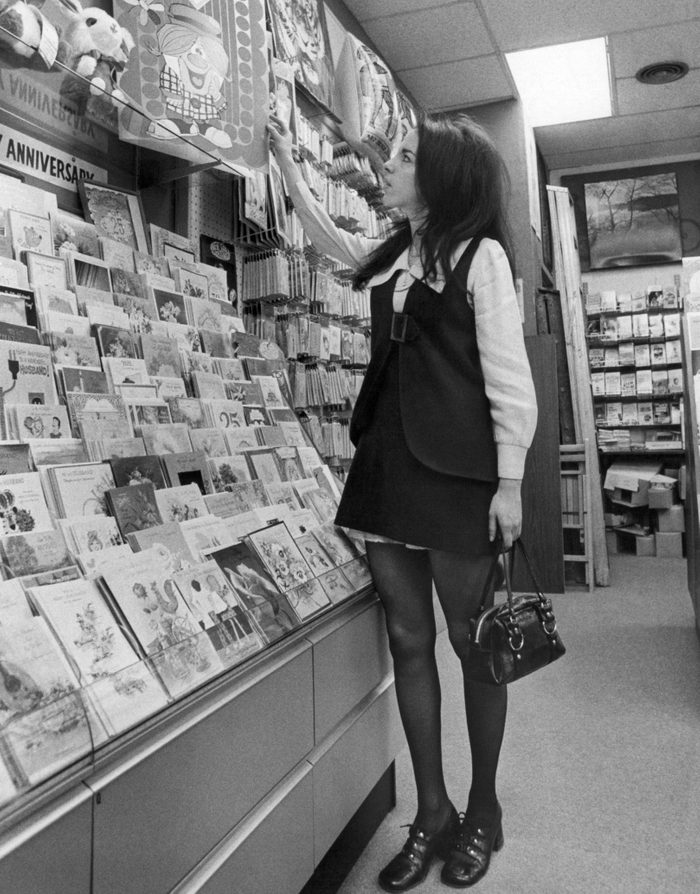 iew of a young woman in a mini skirt as she shops for a comically oversized Valentine's Day card, New York, New York, February 12, 1971. (Photo by Underwood Archives/Getty Images)