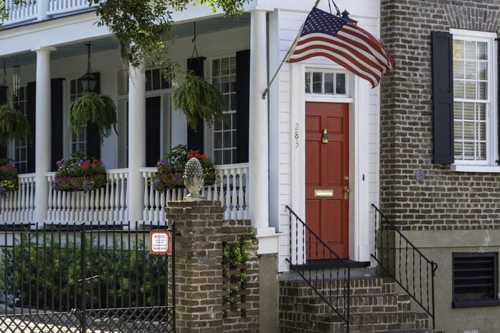 Beautiful facade of a house with a hospitality door in Charleston, South Carolina.